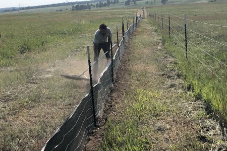 Silt fence installation. Installing silt fence in Black Forest, Colorado
