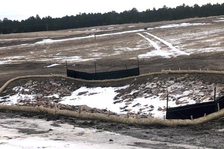 Erosion control measures in place. Silt fence and waddles to slow the mud/silt down in Black Forest, Colorado