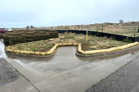 Straw waddles installed in Monument, Colorado to protect the asphalt and concrete areas from mud transferring onto them
