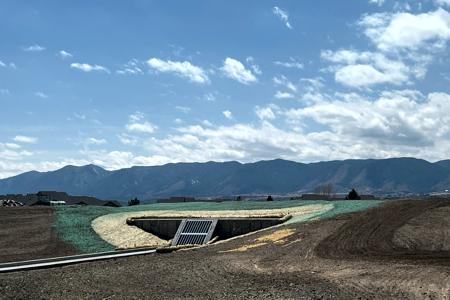Installed Erosion Control in Monument Colorado. Erosion Blanket, straw waddles and Hydro Seed on a pond in a subdivision in Monument, Colorado