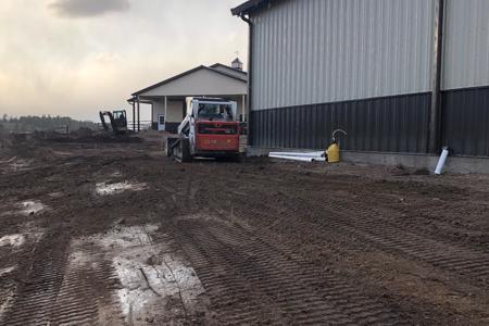 Final grading a new barn in Larkspur, Colorado