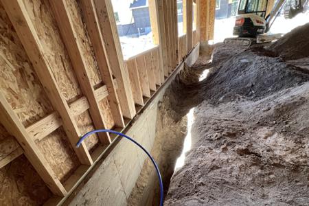 Excavating in Larkspur, Colorado for a new water line to an outbuilding