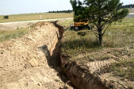 Excavating in Black Forest, Colorado for the installation of a new power line to a home from the street for a power upgrade.
