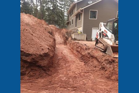 Excavating in Larkspur, Colorado. Excavating a detached garage in Larkspur, Colorado so the foundation can be poured.