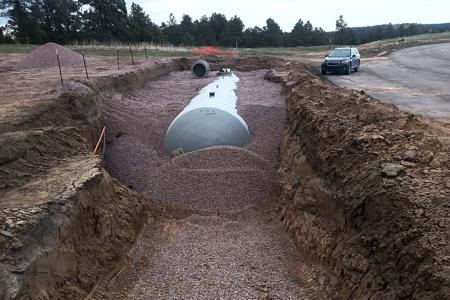 Excavation in Black forest, Colorado. Installing a 30,000 gallon water cistern that will be used by Falcon Fire Department.