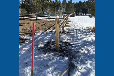 Split rail fence installed in Black Forest, Colorado around the 5 acres to keep some predators out while keeping their dogs in with the installation of wire on the inside