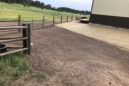 Fence installed in Larkspur, Colorado to keep the horses in the pasture with a gate installed for accessing the pasture.