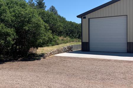 Siloam stone retaining wall in Larkspur, Colorado to direct the water