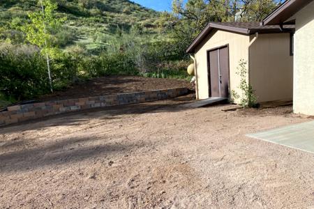Retaining wall Palmer Lake, Colorado. Installed a segmental retaining wall to control the flow of water, to increase the parking size of the home and keep dirt from coming off the hillside.