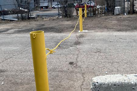 Bollards installed in Colorado Springs. Installed bollards along a property line to keep people from accessing the property in the back to help keep the theft down.